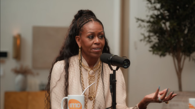 Michelle Obama says people spilled water on her while trying to reach her famous husband