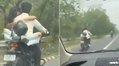 Noida couple fined for flouting traffic rules after video of bike romance goes viral | India News