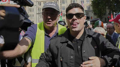 Irish group Kneecap appears in UK court; charged with terror offence over Hezbollah flag; hundreds rally in support outside courthouse