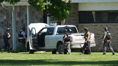 Police say a man opened fire outside a church before staff fatally shot him, averting mass shooting