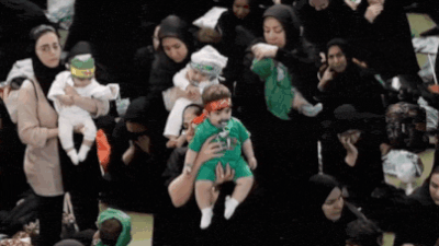 Hosseini infants ceremony: In war’s shadow, hundreds of Iranian mothers offer babies as martyrs – video