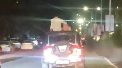 Watch: Couple perform stunts on car roof in Pune; video goes viral | India News
