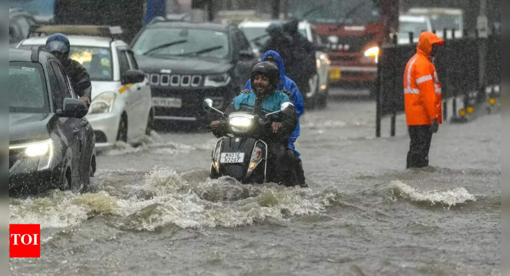Mumbai rains: Heavy showers flood roads, railway tracks; bring city to standstill – video | India News