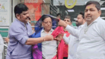 Maharashtra shocker: BJP workers make Congress leader, 73, wear sari for posting against PM Narendra Modi | Thane News