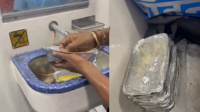 Viral video raises hygiene concerns: Used food foils being washed for reuse on train |