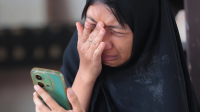 Indonesia families anxious for news after school collapse