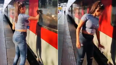 ‘Basic civic sense missing’: Woman cleans train window but litters on tracks; video goes viral | India News