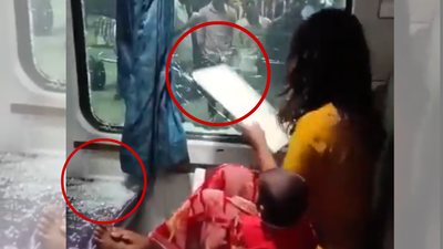 ‘Mera purse chahiye’: Woman with toddler smashes window of train; video goes viral | India News