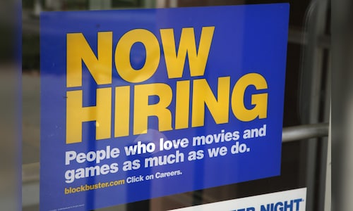 US applications for jobless benefits, a proxy for layoffs, tick down to 209,000 last week