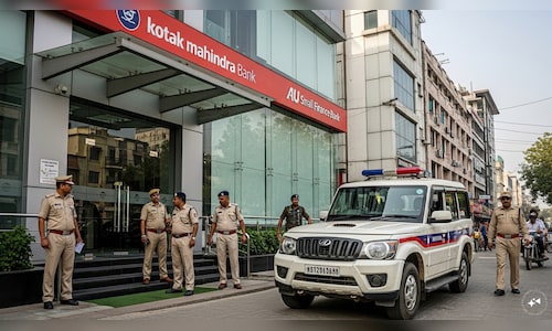 Haryana police at Kotak and AU Small Fin Bank branches; Kotak pays ₹120 cr in Municipal Corp case