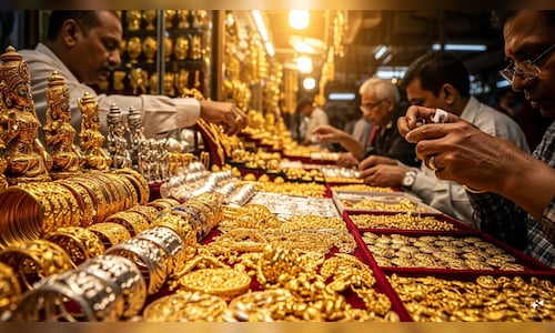 Gold, silver edge lower on MCX as dollar strength weighs