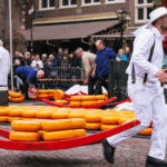 The Cheese ritual: Inside the 660-year-old Dutch market where men in white race with giant cheese wheels | World News