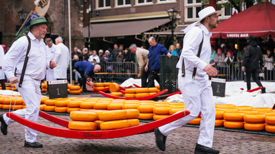 The Cheese ritual: Inside the 660-year-old Dutch market where men in white race with giant cheese wheels | World News